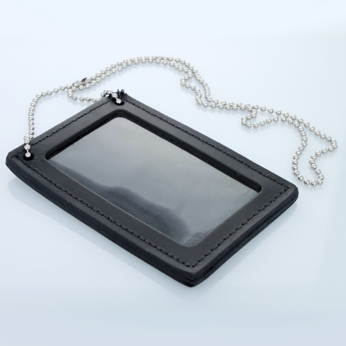 Double-sided leather police badge and ID holder with attached beaded neck chain.
