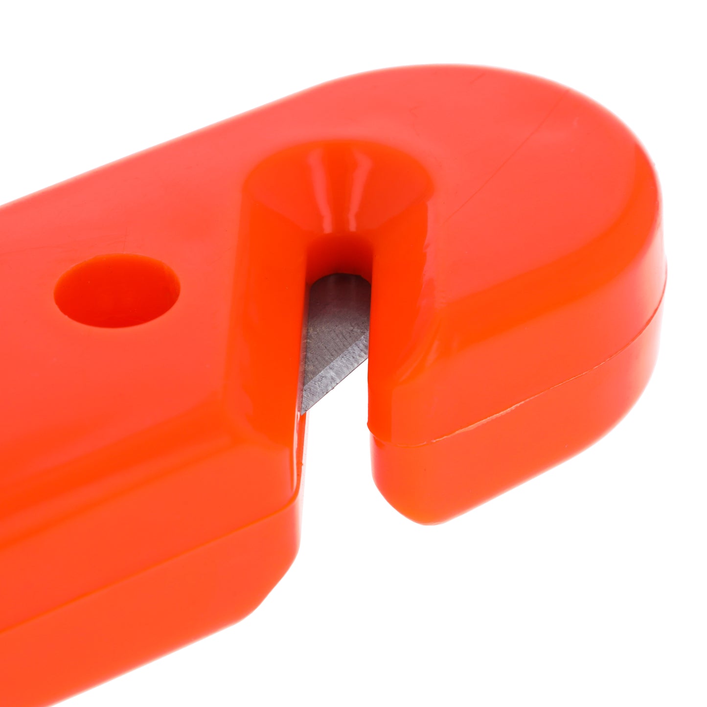 Close-up of recessed seat belt cutter on orange emergency escape tool.