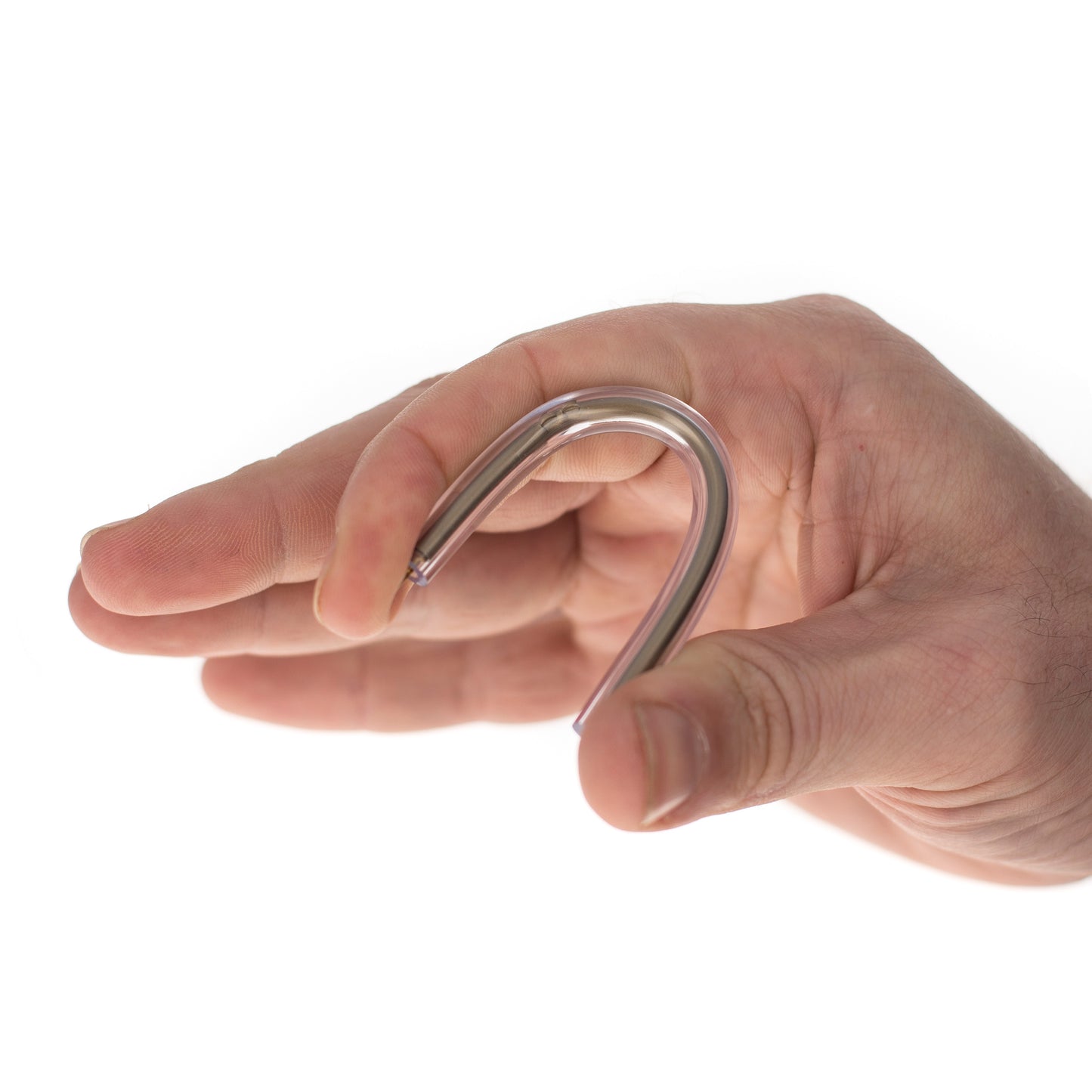 Hand bending flexible ballpoint pen to show soft rubbery material.