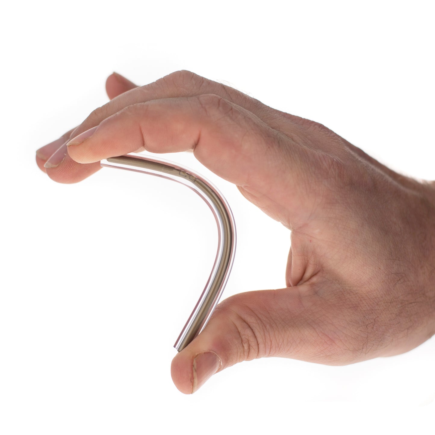 Close-up of hand folding 4.25-inch flexible ballpoint pen in half.