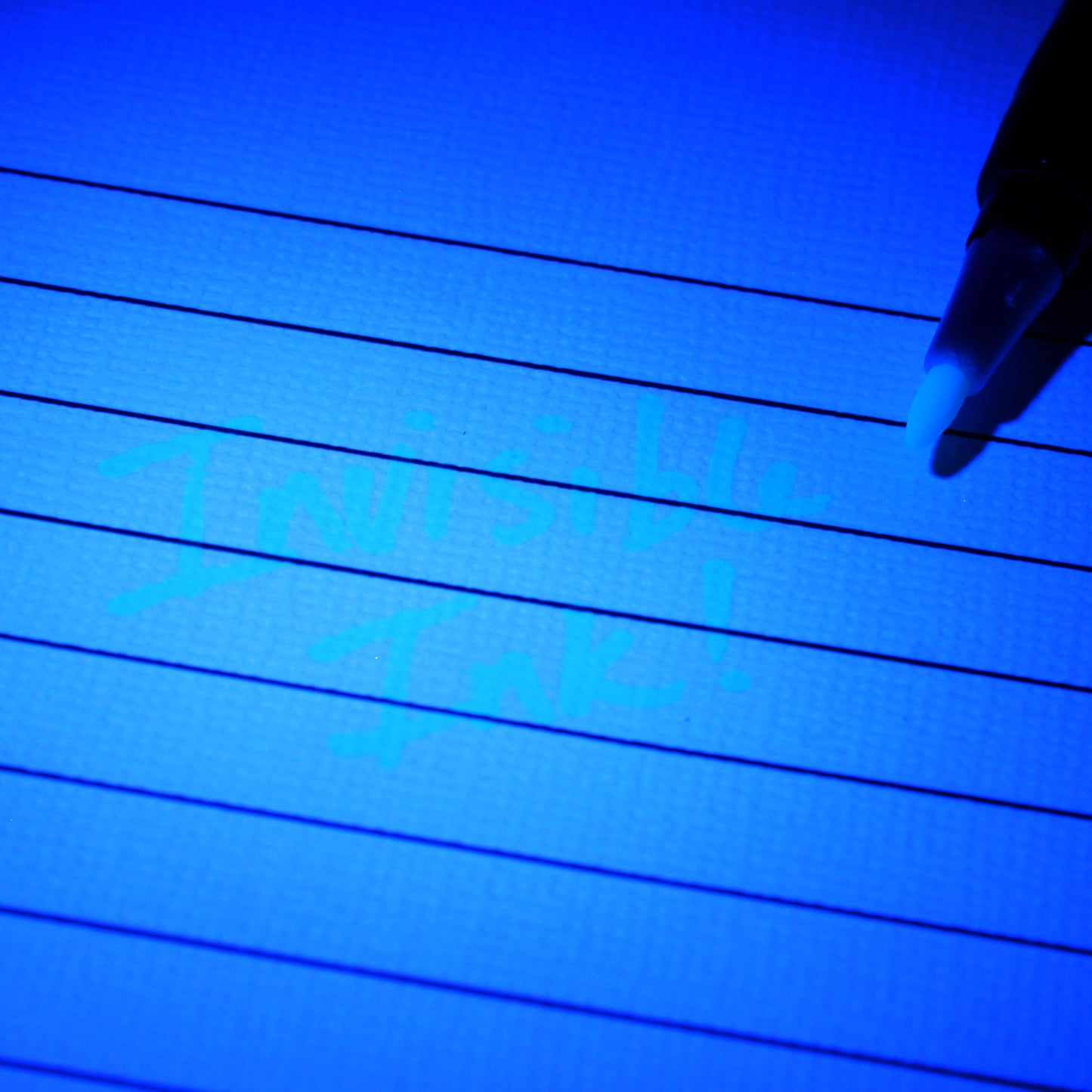 Blue UV invisible ink pen with cap on.