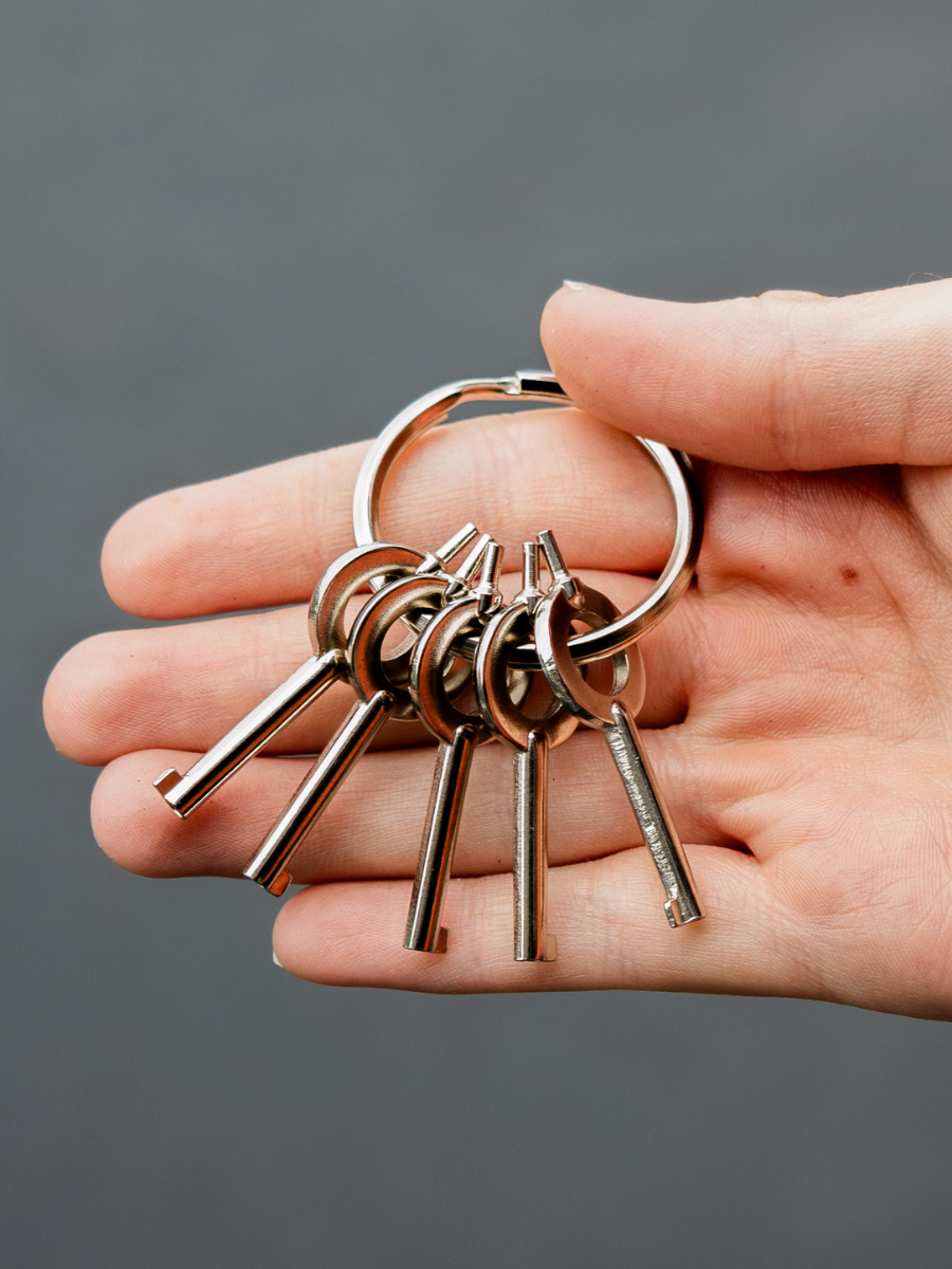 set of five stainless steel universal handcuff keys on key ring