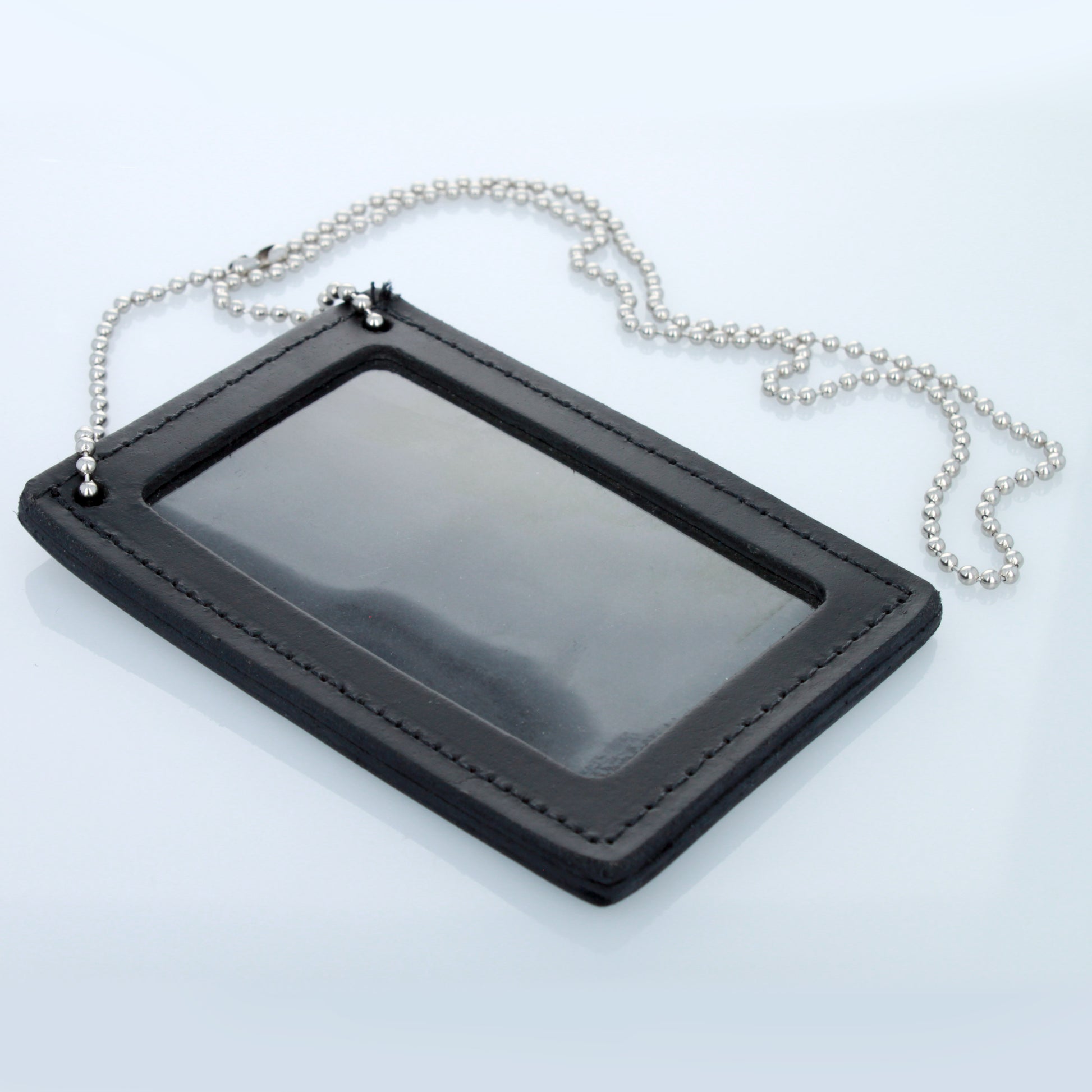 Double-sided leather police badge and ID holder with attached beaded neck chain.