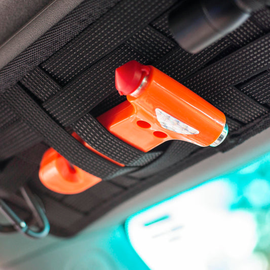 Emergency escape car hammer mounted inside vehicle for easy access.