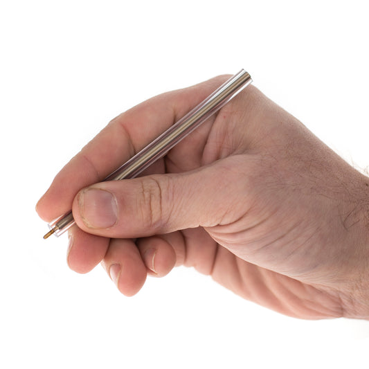 Hand holding non-lethal flexible ballpoint pen with soft bendable casing.